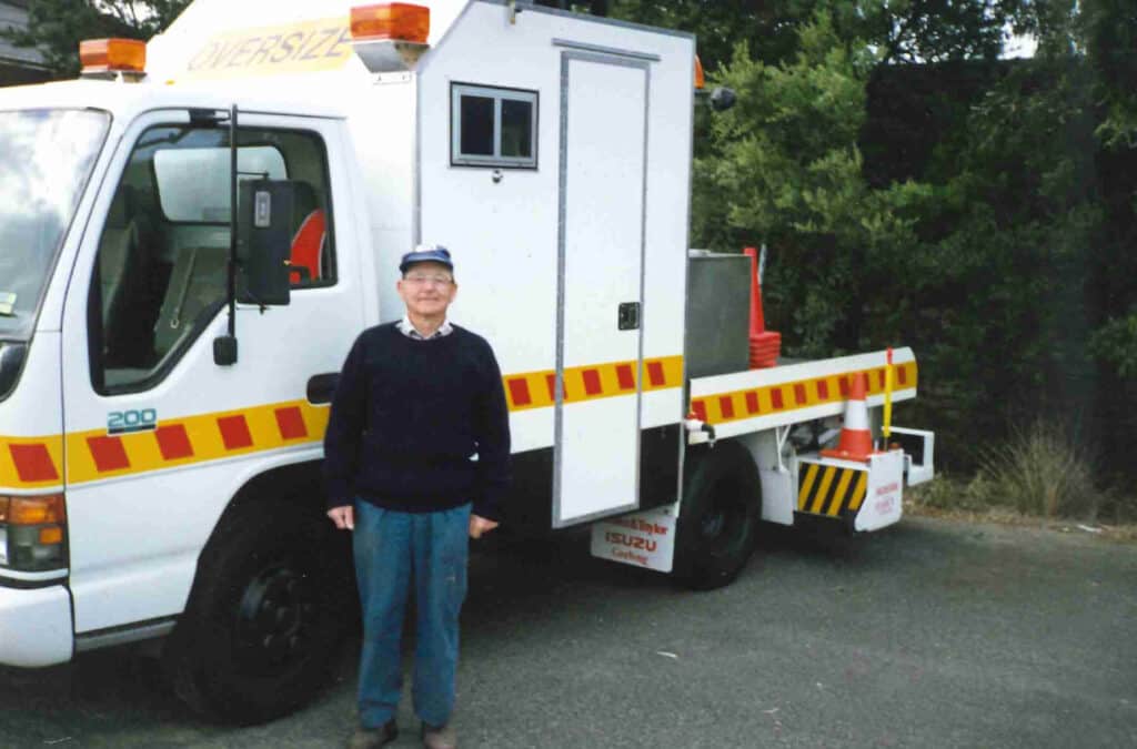 Man standing in front of white Magnetech truck